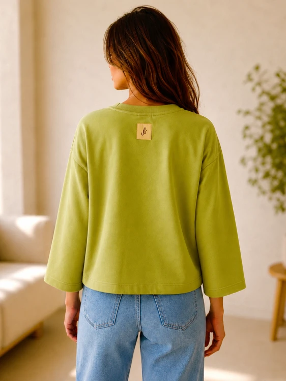 Bluza z rękawem 7/8 w kolorze pistacjowym, widok z tyłu